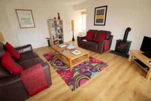a living room with a couch and a coffee table at Castle View Stornoway in Stornoway