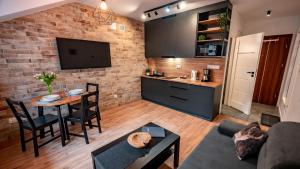 Kuchyň nebo kuchyňský kout v ubytování Centrum Cicha, Sun & Snow