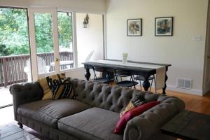 a living room with a couch and a table at North Berkeley Home in Berkeley