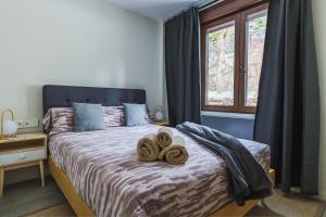 Postel nebo postele na pokoji v ubytování Apartamentos Mikka Clos