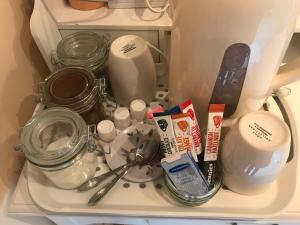 a shelf in a refrigerator filled with food and utensils at Willow Ridge - a large country house with a king and Single or Twin room in Clutton