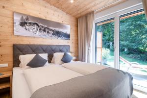 Postel nebo postele na pokoji v ubytování Ticklhof am See