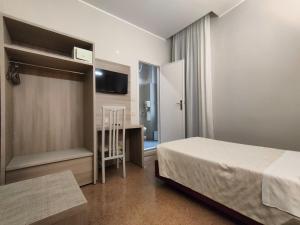 Posteľ alebo postele v izbe v ubytovaní Hotel Vittoria