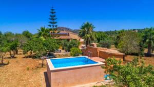 an outdoor swimming pool in front of a house at Cala mezquida - 42214 Mallorca in Capdepera