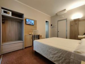 Posteľ alebo postele v izbe v ubytovaní Hotel Vittoria