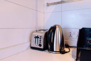 a toaster sitting on a counter in a kitchen at Amani Cottage in Dambani