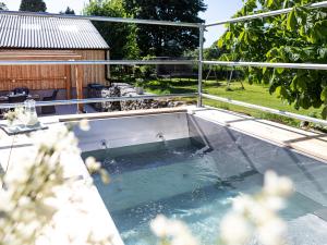 a pool of water on top of a patio at Longlands Farm Cottage in Grange Over Sands