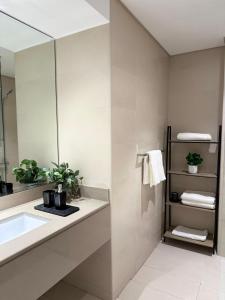 a bathroom with a sink and a mirror at Out of Mood ! luxury stay!! Abu Dhabi Yas Island in Abu Dhabi