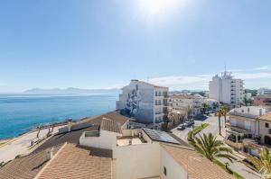 a view of a city and the ocean at YourHouse Monges sea view Studio in Can Picafort