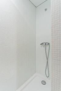 Et badeværelse på Coreto Apartment + 19 billeder