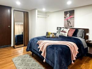 Ένα ή περισσότερα κρεβάτια σε δωμάτιο στο Madre tierra suites tlalpujahua centro