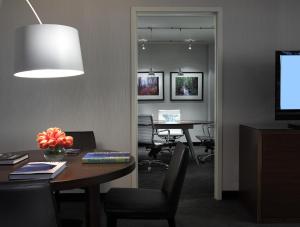 TV a/nebo společenská místnost v ubytování Hotel Murano