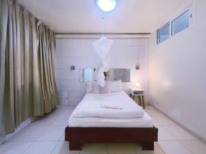 Krevet ili kreveti u jedinici u okviru objekta Appartement avec jardin au coeur des mamelles