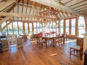 a dining room with a table and chairs at Oakenhurst in Fowey