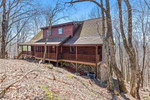 a large wooden house in the middle of the woods at Rustic Elegance in Boone