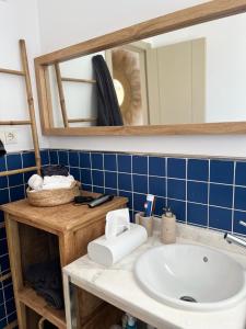 a bathroom with a sink and a mirror at Moraira Fantástico Ático Duplex in Moraira