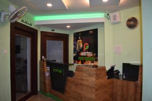 a restaurant with avertisement for avertisementosateosateosateosateosateosateosateosate at HOTEL PURI GREENS in Puri