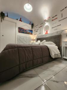 a bedroom with a large bed in a room at Suite SAN GENNARO in Naples +126 photos