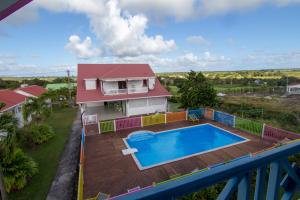 an aerial view of a house with a swimming pool at Chambres d'hôte Beauséjour in Beauséjour