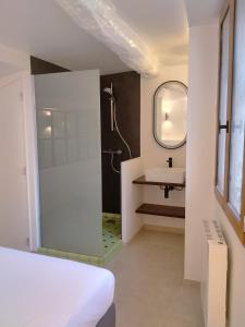 a bathroom with a shower and a sink at Apartement Victor in Tourtour