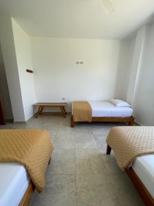 Voodi või voodid majutusasutuse Samana Hostal, Puerto Engabao toas