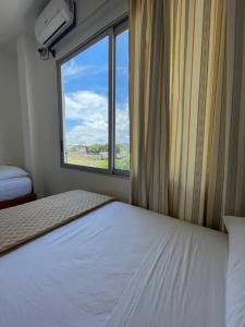 Voodi või voodid majutusasutuse Samana Hostal, Puerto Engabao toas