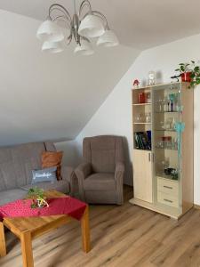 Posezení v ubytování Ferienwohnung Am Froschteich