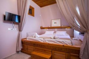 Кровать или кровати в номере Margaritas apartments