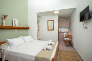 Кровать или кровати в номере Margaritas apartments