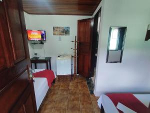 TV a/nebo společenská místnost v ubytování Pousada Taquinha Paraty