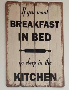 a sign that says if you want breakfast in bed go sleep in the kitchen at Bristol City Stays - 1 Bed - Pembroke Court in Bristol