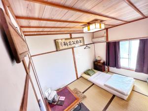 Postel nebo postele na pokoji v ubytování Bighem Maison 2