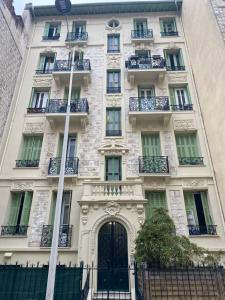 an apartment building in paris with a gate at Nice Center Room in Nice