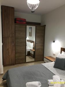 Ένα ή περισσότερα κρεβάτια σε δωμάτιο στο Iliokalli Apartment
