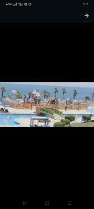 a picture of a resort with a swimming pool at شقق فندقيه في ابراج بورتو السخنه in Ain Sokhna