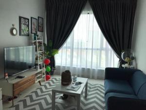 Et sittehjørne på Penang Airport Executive Suites and Family Getaway, Sleeps 2-6