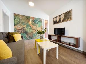 a living room with a couch and a table at Apartments Teodora Maria in Novigrad Istria