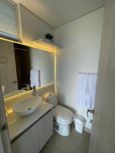 a bathroom with a sink and a toilet at Infinity Blue - Playa Dormida in Santa Marta +26 photos