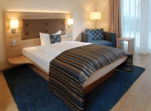 Postel nebo postele na pokoji v ubytování Hotel Simonshof