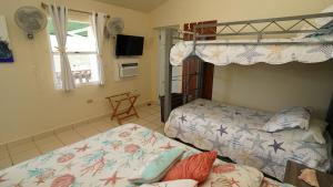 Postel nebo postele na pokoji v ubytování Coqui Beach Home, Culebra