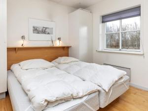 En eller flere senger på et rom på Apartment Hals V