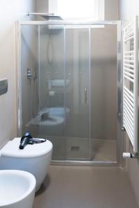 a bathroom with a shower with a toilet and a sink at CASA VACANZE BONAVENTURA in Marsala +19 photos