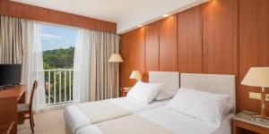 Postel nebo postele na pokoji v ubytování Marko Polo Maradiso Hotel by Aminess