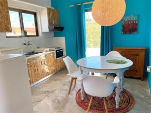 A kitchen or kitchenette at The Beachhouse Apartments