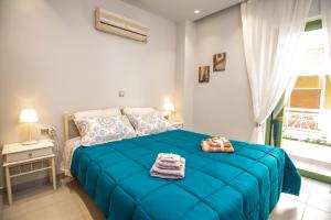 Postel nebo postele na pokoji v ubytování LOUTRAKI HOUSE