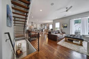 a living room with a couch and a table at City Views RoofTop Hot Tub & Short Walk to Stadium in Charlotte