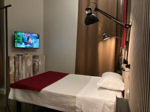 Posteľ alebo postele v izbe v ubytovaní Hotel Calypso