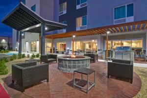a patio with a fire pit in front of a building at TownePlace Suites by Marriott El Paso East/I-10 in El Paso