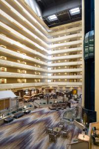 a large building with a lobby with tables and benches at Albuquerque Marriott Pyramid North in Albuquerque
