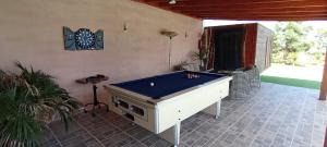 a room with a pool table in a patio at Finca La Baifa in Santa Cruz de Tenerife